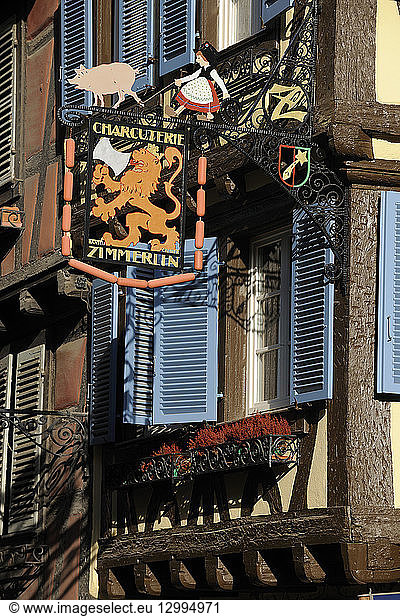 France  Haut Rhin  Alsace Wine Route  Colmar  sign of a former charcuterie or butcher shop called Maison Zimmerlin at number 7 rue des Serruriers drawn by Hansi