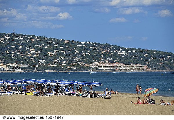 France  Herault  Sete  Beach of Lido  vacationers taking the sun in sea border with Saint Clair Mount in the background