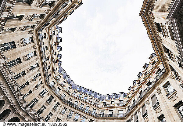 France  Ile-de-France  Paris  Low angle view of apartments surrounding Square Edouard-VII