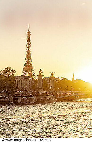 France  Ile-De-France  Paris  Seine river at sunset with Eiffel Tower and Pont Alexandre III bridge in background