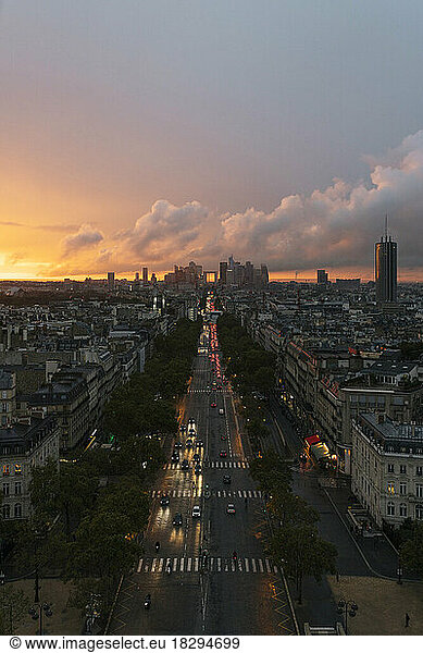 France  Ile-de-France  Paris  Traffic along city street seen from top of Arc de Triomphe at sunset