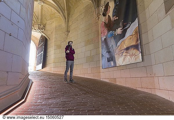 France  Indre et Loire  Loire valley listed as World Heritage by UNESCO  Amboise  Amboise castle  The portrait of the graffiti artist Ravo in residence at the Amboise castle in front of his reproductions of the painting Death of Leonard de Vinci