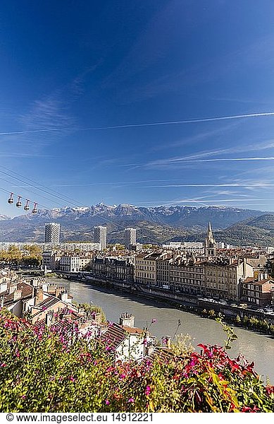 France  Isere  Grenoble  view of Grenoble-Bastille cable car and its Bubbles  the oldest city cable car in the world  view of the 13th century Saint Andre church and Belledonne massif