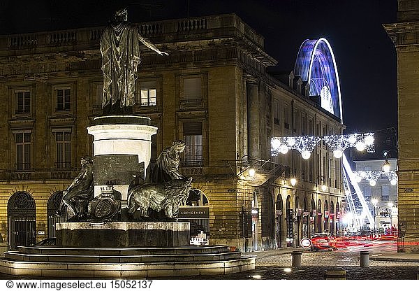 France  Marne  Reims  night view of place Royale and Forum place with big wheel  statue of Louis XV and car headlights