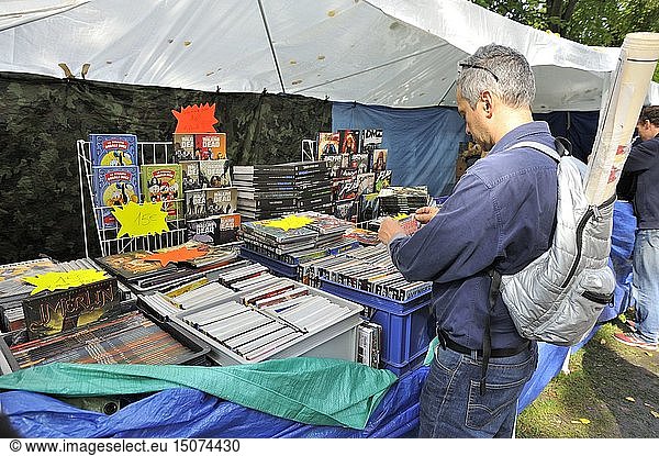France  Nord  Lille  braderie 2017  secondhand traders along the esplanade  man loocking after a book