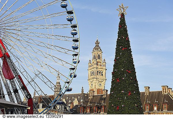 France  Nord  Lille  Place du General de Gaulle or Grand Place  big wheel and giant Christmas tree installed for Christmas and New Year partly masking the belfry of the Chamber of Commerce and Industry and the Old Stock Exchange