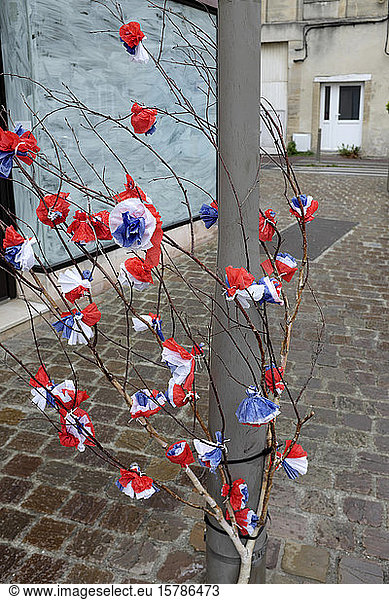 France  Normandy  Decoration for the D-Day holiday (June 6  1944 as the start of the Allied landing in Normandy during World War II) - red  white  blue flowers made of paper
