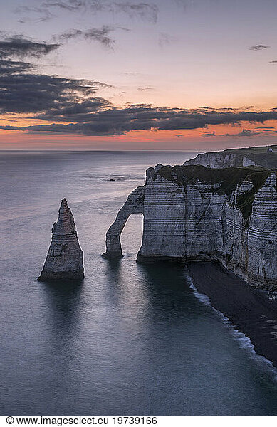 France  Normandy  Long exposure of Falaise dAval and Aiguille dEtretat rock formation at dawn