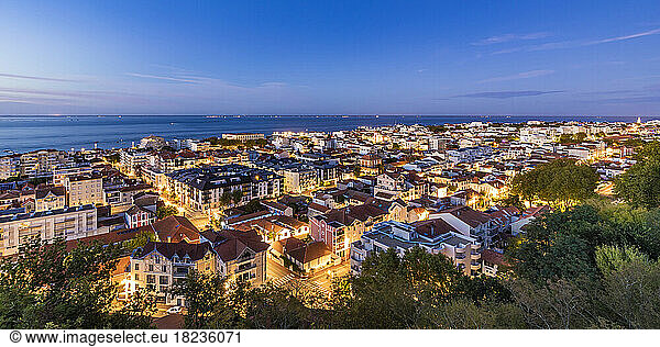 France  Nouvelle-Aquitaine  Arcachon  Panoramic view of seaside town at dusk