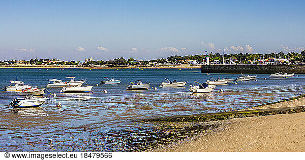 France  Nouvelle-Aquitaine  La Flotte  Panoramic view of boats at edge of beach