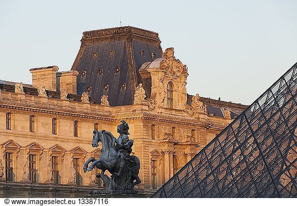 France  Paris  area listed as World Heritage by UNESCO  Louvre pyramid by architect Leoh Minh Pei and the equestrian statue of Louis XIV in the Cour Napoleon of the Louvre Museum