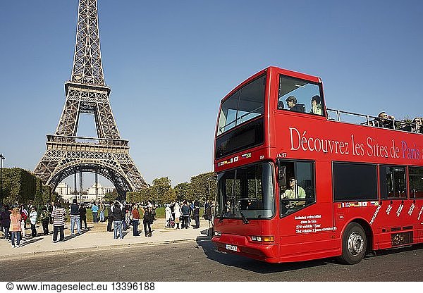 France  Paris  Red Bus  double decker touristic bus in front of the Eiffel Tower