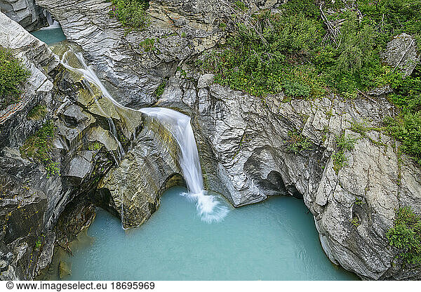France  Savoie  Arc stream flowing into alpine pool in Vanoise National Park