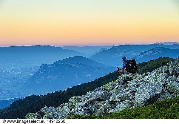 France  Savoie  Arvillard  hiker contemplating the daybreak near the shelter of the Perrière (1832m)