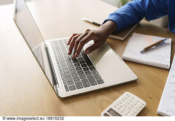 Freelancer working on laptop at desk