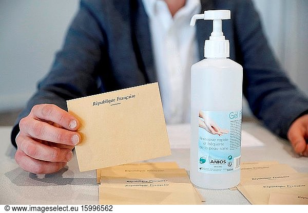 French election during coronavirus (COVID-19) crisis. Antibacterial hand gel.