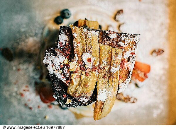 french toast breakfast with bananas and nuts on a plate