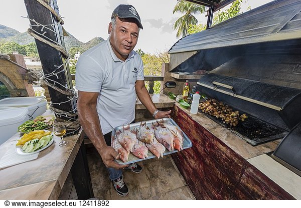 Fresh caught fish being prepared at a private restaurant in Nueva Gerona on Isla de la Juventud  Cuba.