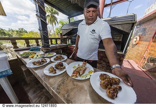 Fresh caught fish being prepared at a private restaurant in Nueva Gerona on Isla de la Juventud  Cuba.