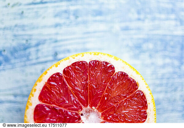 Fresh chopped grapefruit on wood
