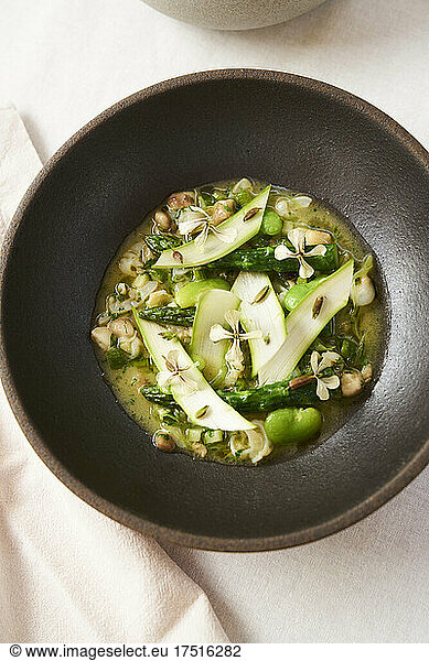Fresh gourmet meal farm to table asparagus dish at restaurant table