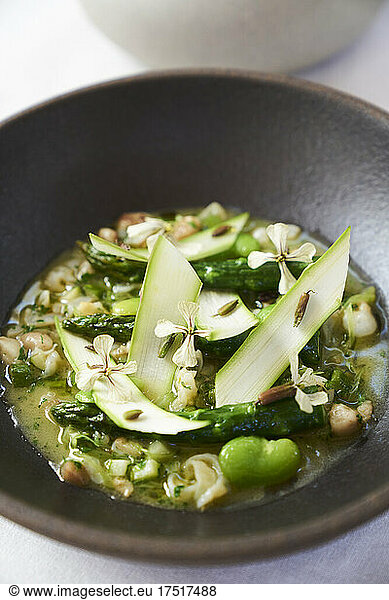 Fresh gourmet meal farm to table asparagus dish at restaurant table