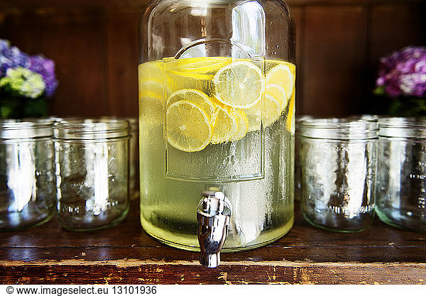 Fresh lemonade in glass jar on table