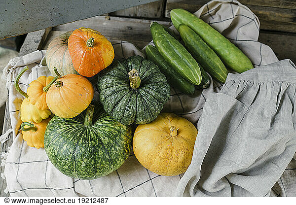 Fresh pumpkins and cucumbers at porch