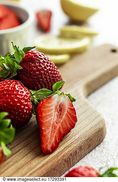 Fresh ripe strawberries on cutting board