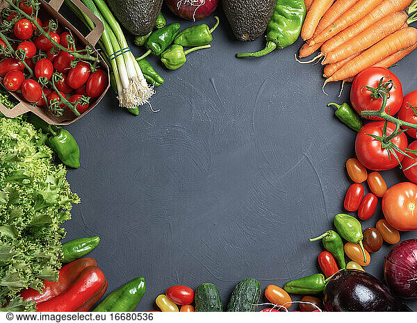 Fresh vegetables with circle in the center for copy space dark w