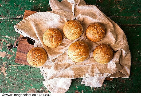 Freshly baked round rolls on tea towel  bread  food photography