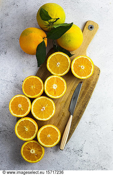Freshly cut oranges on cutting board