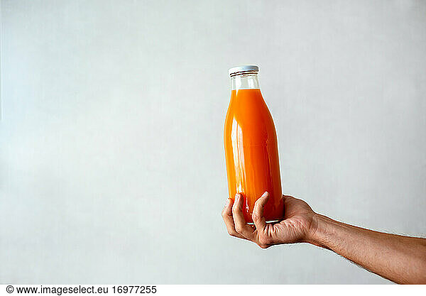Freshly squeezed orange juice on white background