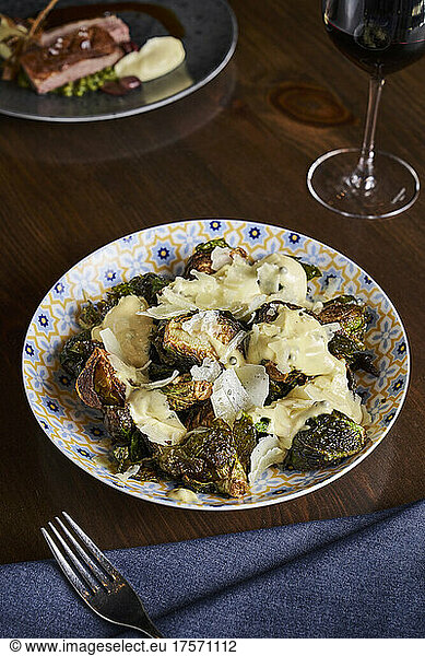 Fried brussel sprouts with a parmesan cream sauce.