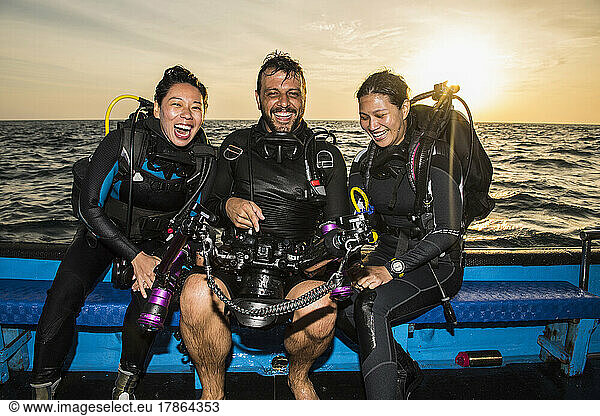 friends checking pictures on underwater camera at Tubbataha reef