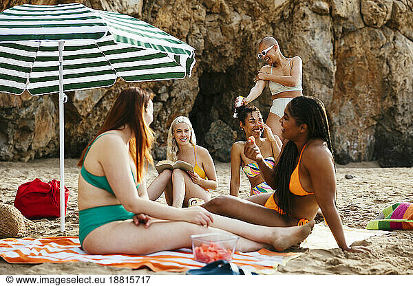 Friends enjoying and spending leisure time at beach