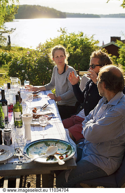 Friends having meal outdoors