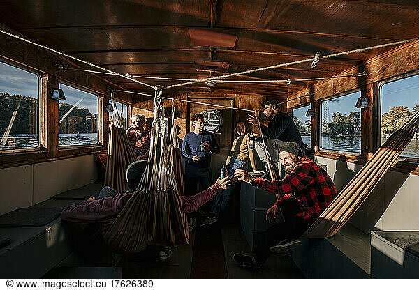 Friends spending leisure time together on boat