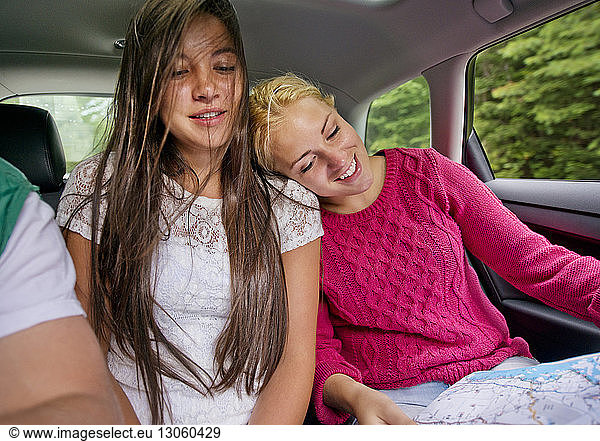 Friends traveling in car