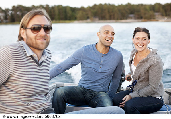 Friends traveling in motorboat