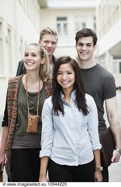 Front view portrait of happy young friends together