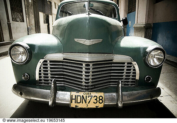 Frontal of old Chevy car parked on a narrow street  Havana  Cuba.