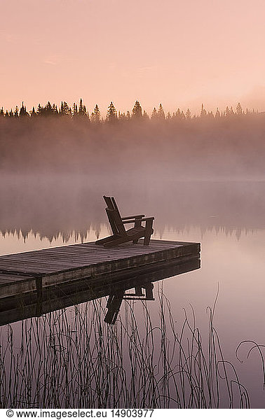 Frost covered dock at sunrise  Glad Lake  Duck Mountain Provincial Park; Manitoba  Canada
