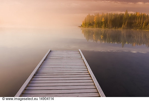 Frost covered dock at sunrise  Glad Lake  Duck Mountain Provincial Park; Manitoba  Canada