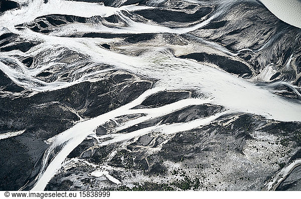 Frozen rivers covered in snow cutting through mountains