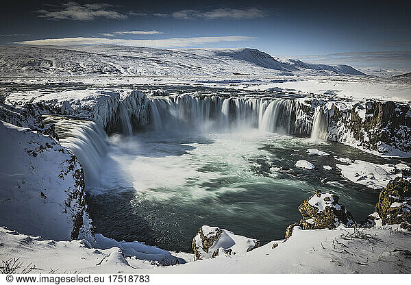 frozen waterfall from aerial view named Godafoss