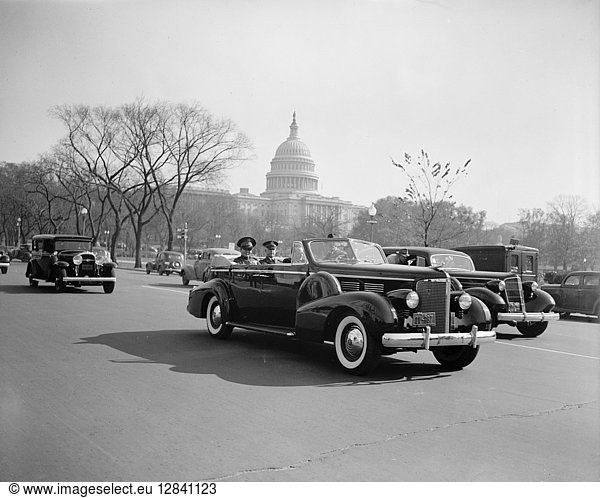 FULGENCIO BATISTA (1901-1973). Cuban soldier and dictator. Batista with U.S. Army Chief of Staff  General Malin Craig  in a car passing the Capitol building in Washington  D.C.  10 November 1938.