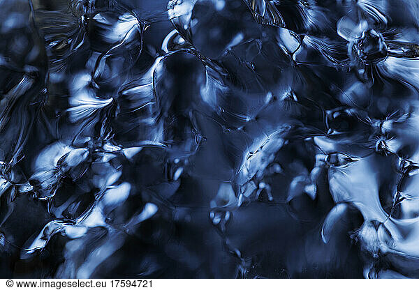 Full frame of clear blue melting ice