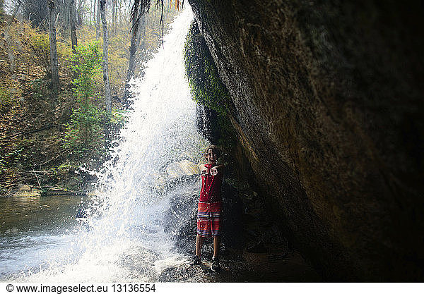 Full length of boy standing by Bua Thong Waterfalls