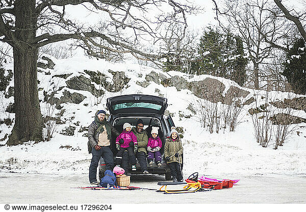 Full length of happy family on winter vacation